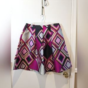 Striking A-line bold color geometric design skirt by LANE BRYANT. Size 16